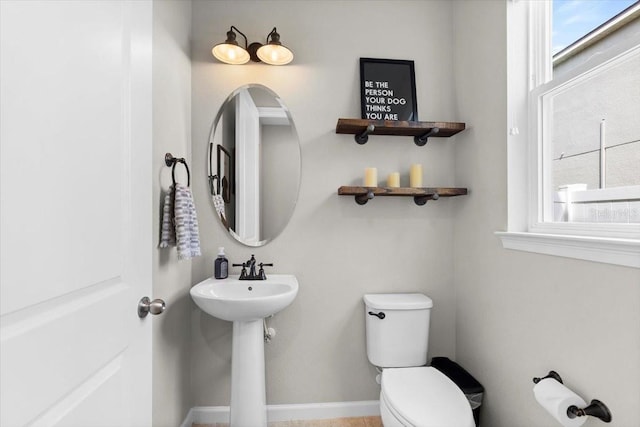 bathroom featuring sink and toilet