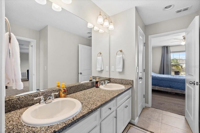 bathroom featuring tile patterned floors, ceiling fan, and vanity