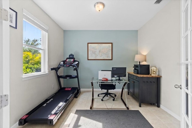 tiled office space with a healthy amount of sunlight