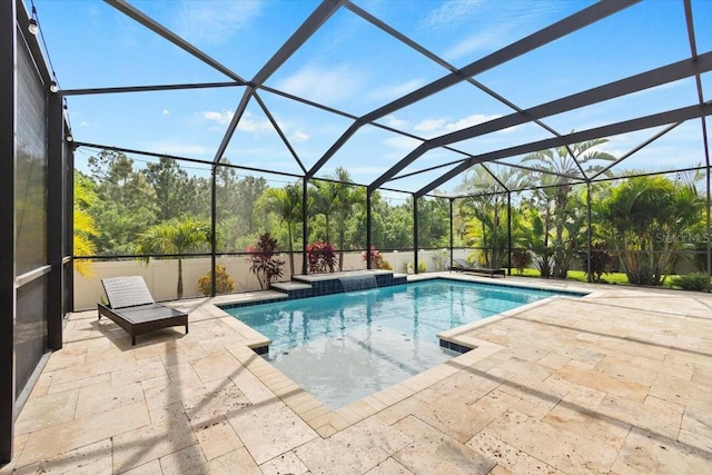 view of pool with a patio area and a lanai