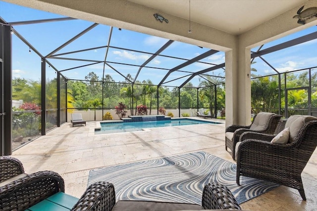 view of swimming pool with an in ground hot tub, a patio, and a lanai