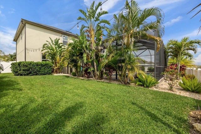 view of yard with a lanai