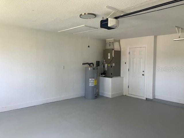 garage with electric water heater, heating unit, and a garage door opener