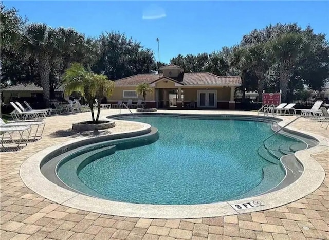 view of swimming pool featuring a patio area