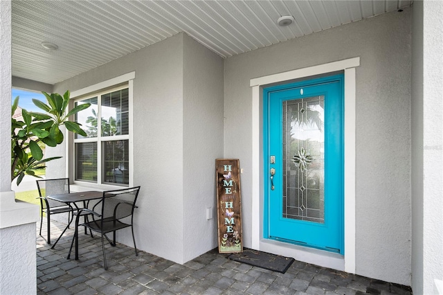 doorway to property with a porch