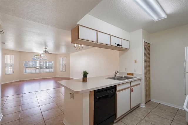 kitchen featuring ceiling fan, white cabinetry, sink, black dishwasher, and light tile patterned floors