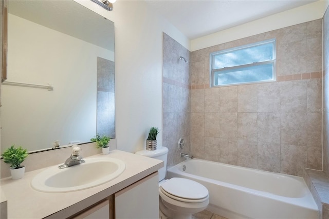 full bathroom with tiled shower / bath combo, toilet, and vanity