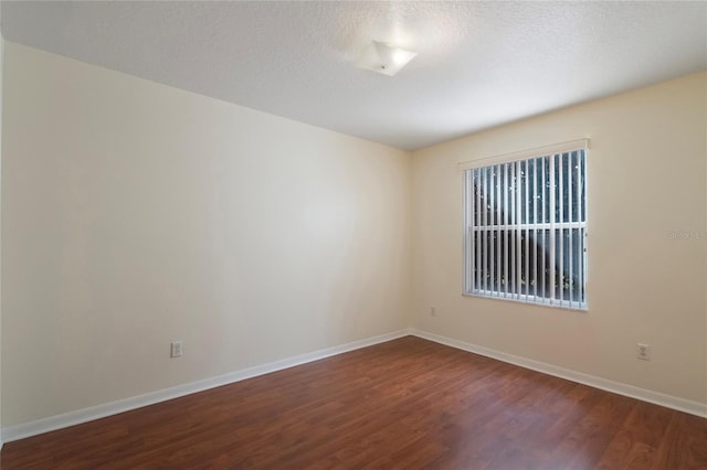 empty room with wood-type flooring