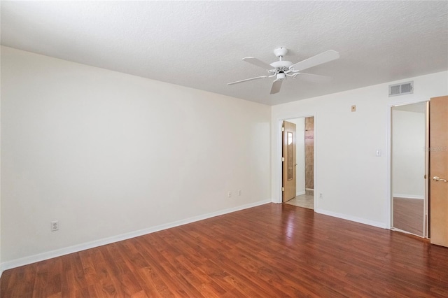 spare room featuring ceiling fan, wood-type flooring, and a textured ceiling