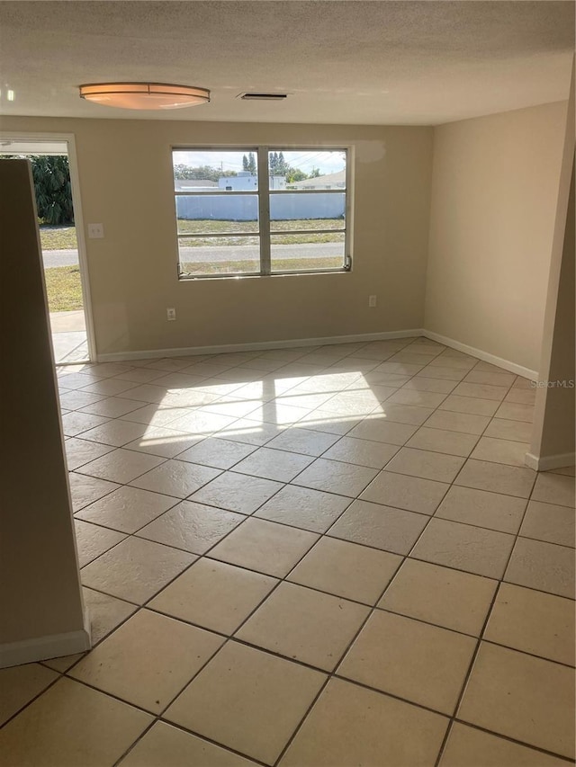 view of tiled spare room