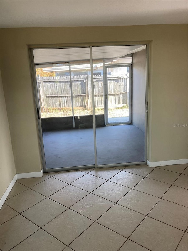 spare room featuring light tile patterned floors