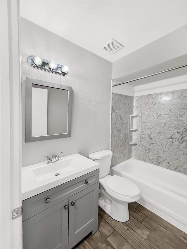 full bathroom featuring shower / washtub combination, vanity, and toilet