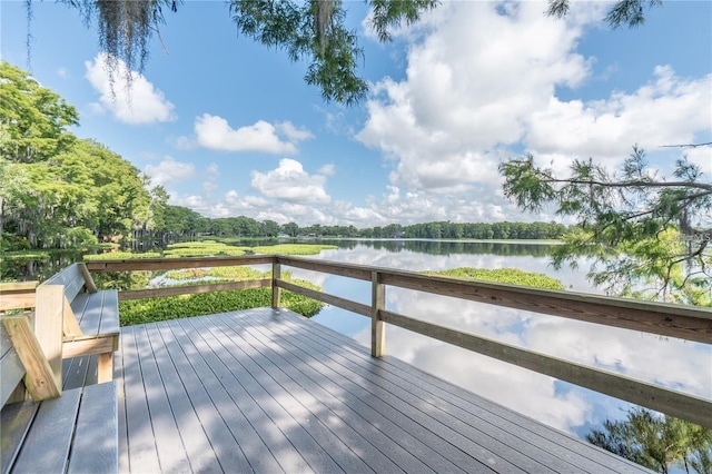 wooden deck with a water view