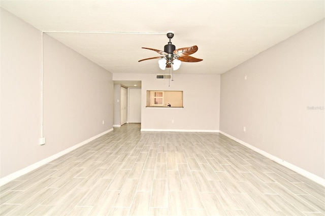 unfurnished room featuring ceiling fan and light hardwood / wood-style floors