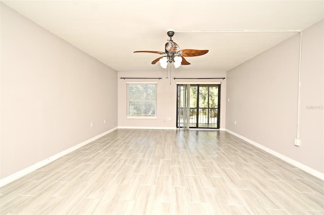 spare room with ceiling fan and light hardwood / wood-style floors