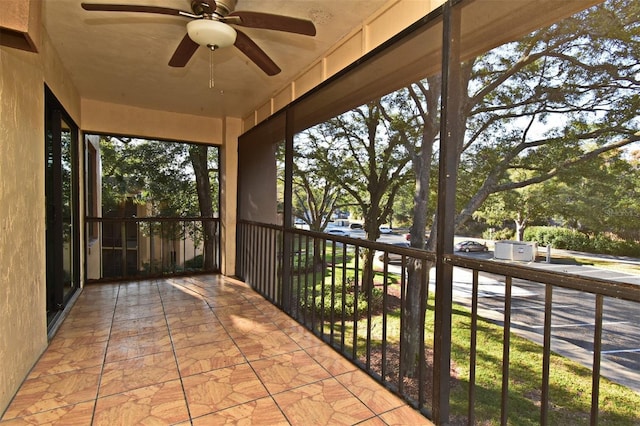 exterior space with a balcony and ceiling fan