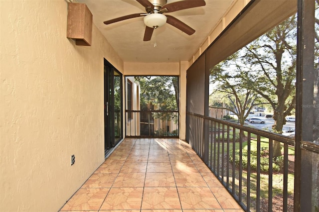 exterior space with ceiling fan