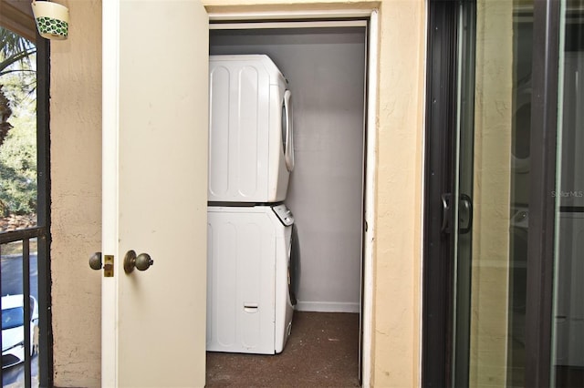 laundry area with stacked washer and dryer