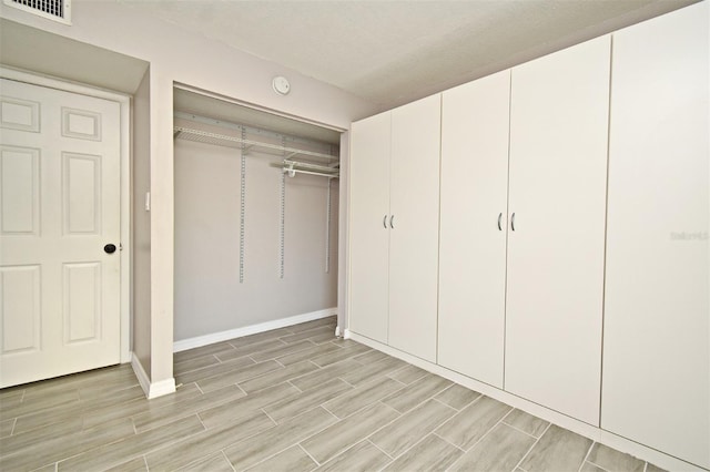 unfurnished bedroom featuring a closet