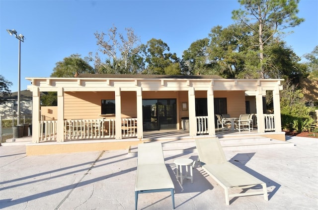 rear view of property featuring a patio