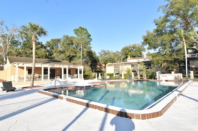 view of swimming pool with a patio area