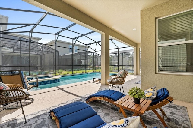 view of patio with glass enclosure and a swimming pool with hot tub