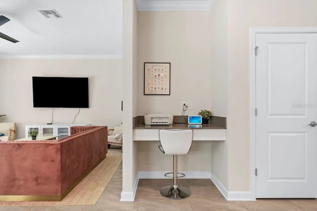 tiled office featuring built in desk and ornamental molding