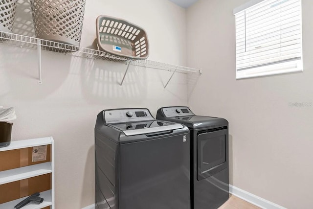 laundry room featuring washing machine and dryer