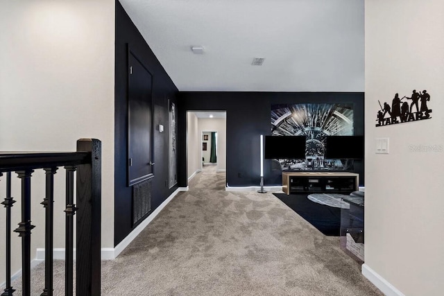 hallway with carpet flooring