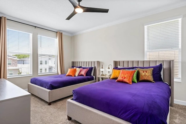 bedroom featuring ceiling fan, light colored carpet, and crown molding