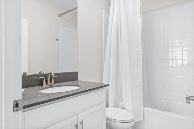 full bathroom with toilet, shower / bath combo, and vanity