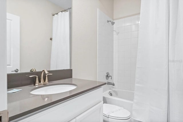 full bathroom featuring toilet, vanity, and shower / bathtub combination with curtain