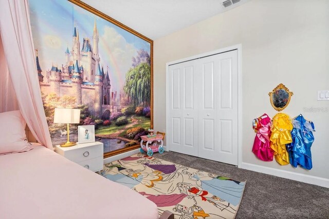 bedroom with a closet and carpet