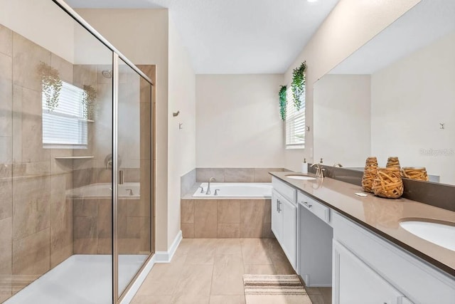 bathroom with shower with separate bathtub, vanity, and tile patterned flooring