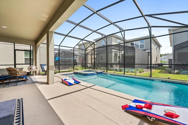 view of swimming pool featuring a patio, glass enclosure, and an in ground hot tub