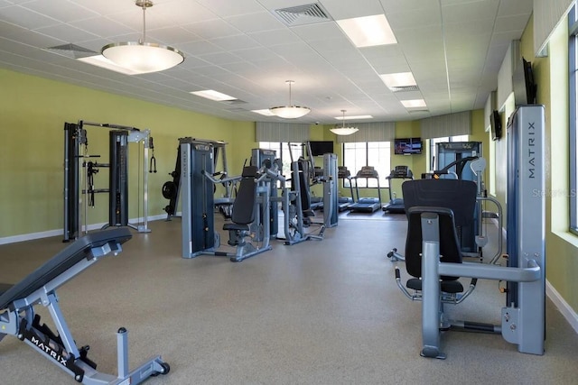 gym featuring a paneled ceiling