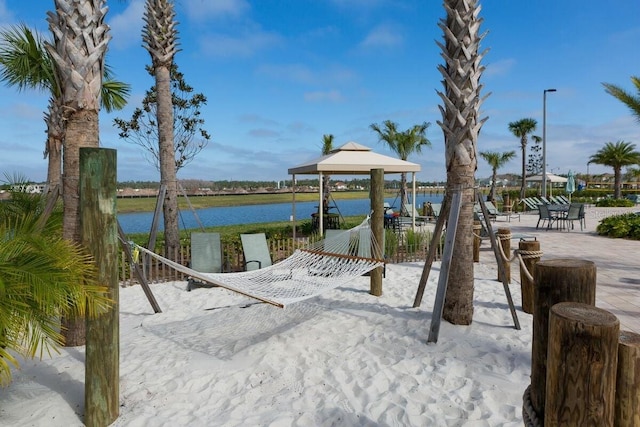 view of home's community featuring a gazebo and a water view