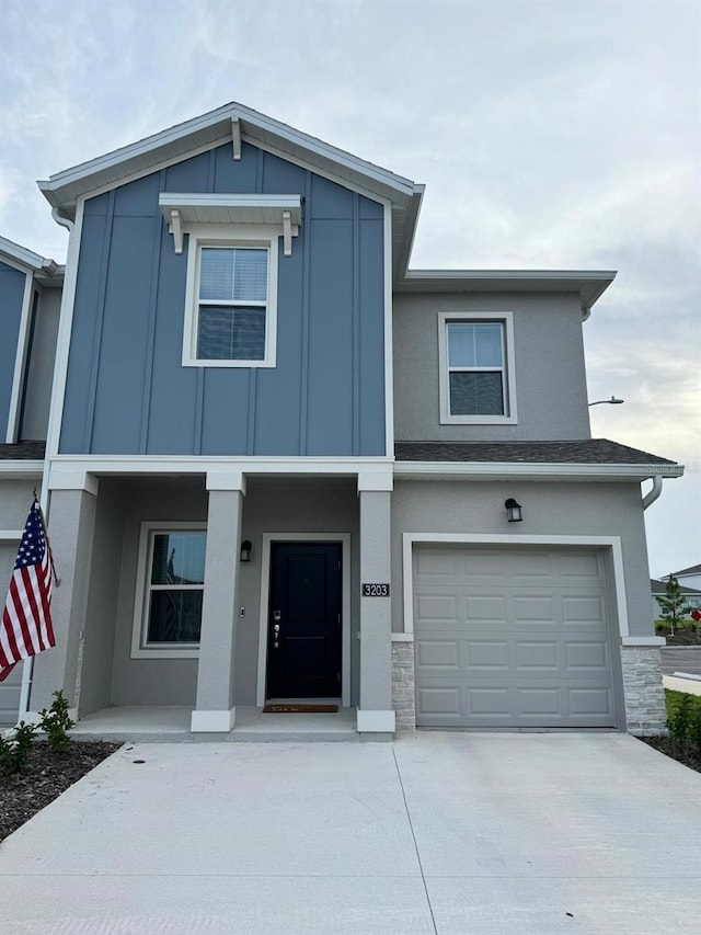 view of front of property with covered porch and a garage