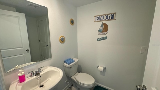 bathroom featuring sink and toilet