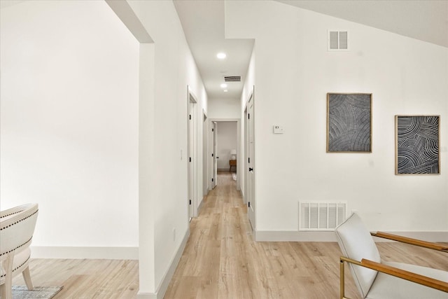 corridor with recessed lighting, visible vents, light wood-style flooring, and baseboards