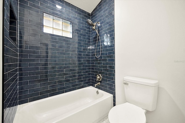 bathroom featuring toilet and  shower combination