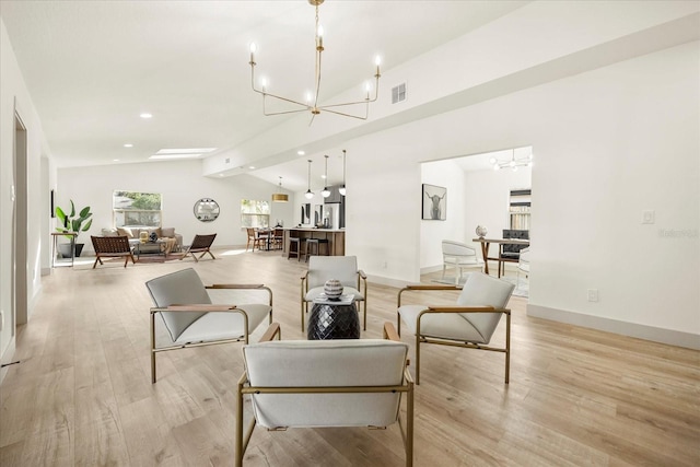 living room with a chandelier, lofted ceiling, light wood-style flooring, recessed lighting, and baseboards