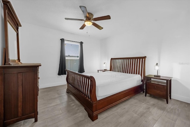 bedroom featuring ceiling fan and light hardwood / wood-style flooring