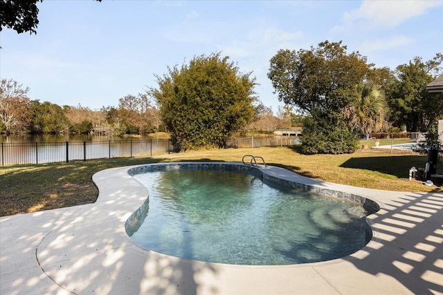 view of swimming pool featuring a water view and a yard