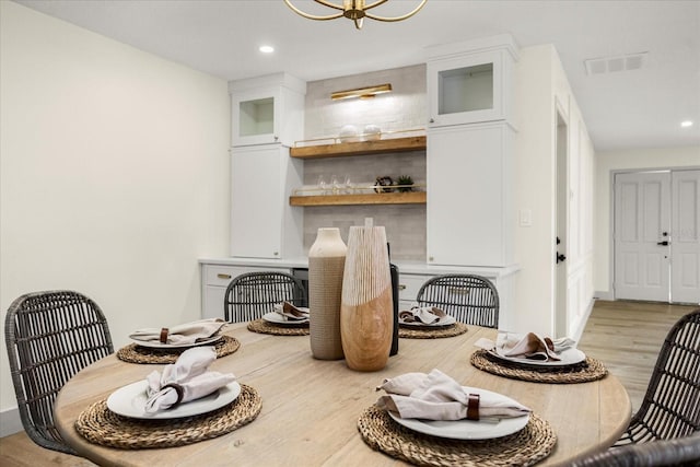 dining area with light hardwood / wood-style flooring