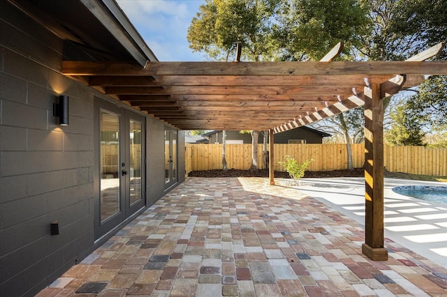 view of patio with a fenced in pool, a pergola, and french doors