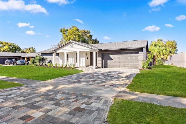ranch-style home with a porch, a front yard, a garage, decorative driveway, and fence