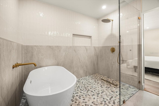bathroom with a freestanding bath and walk in shower