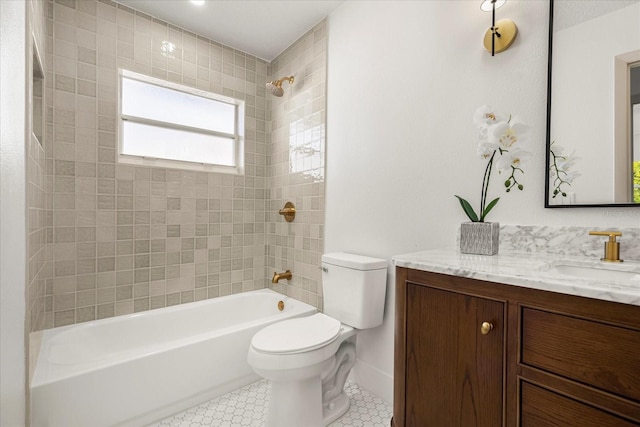 full bath featuring vanity, toilet, tile patterned flooring, and bathtub / shower combination