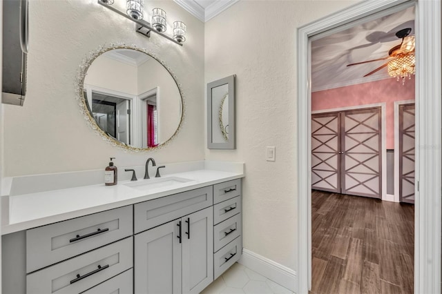 bathroom with vanity, ceiling fan, and ornamental molding